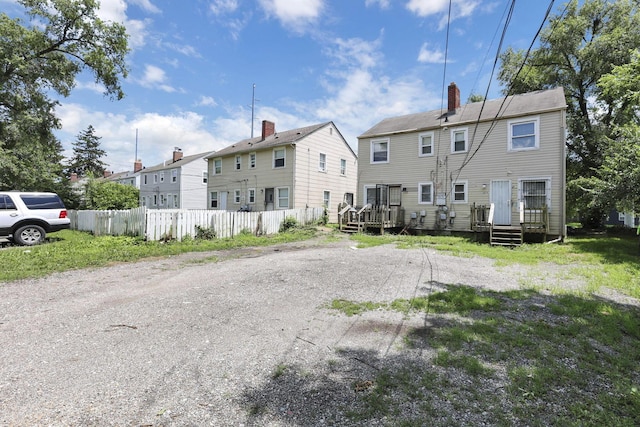 1077-1079 S James Rd, Columbus, OH 43227 - rear view of property featuring a chimney and a residential view