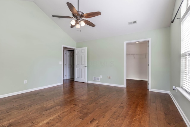 810 Lambton Cir W, Lancaster, OH 43130 - unfurnished bedroom featuring a spacious closet, dark wood-style floors, high vaulted ceiling, a closet, and a ceiling fan