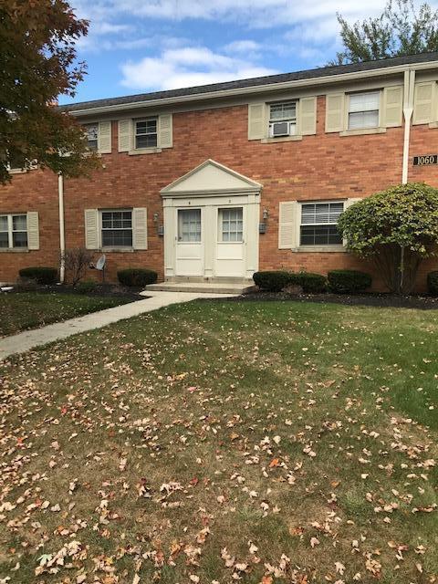 1060 Sells Ave Unit 104, Columbus, OH 43212 - view of front of house featuring brick siding and a front lawn