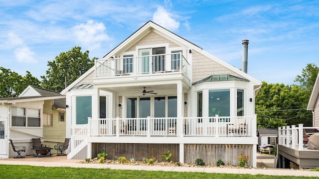 4721 W N Bank Rd, Buckeye Lake, OH 43008 - rear view of property with a balcony, a porch, a standing seam roof, a metal roof, and ceiling fan