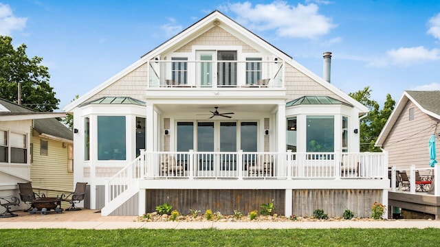 4721 W N Bank Rd, Buckeye Lake, OH 43008 - rear view of house with a standing seam roof, a balcony, a porch, and a ceiling fan