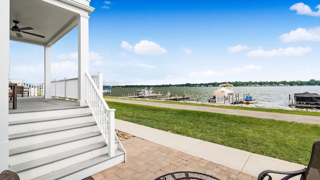4721 W N Bank Rd, Buckeye Lake, OH 43008 - view of patio featuring a water view, a ceiling fan, and a dock