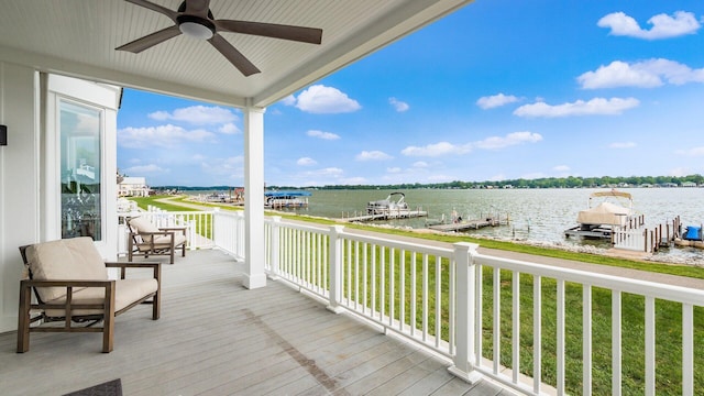 4721 W N Bank Rd, Buckeye Lake, OH 43008 - deck with a water view, ceiling fan, a boat dock, and a yard