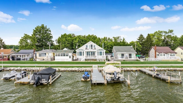 4721 W N Bank Rd, Buckeye Lake, OH 43008 - dock area featuring boat lift, a water view, and view of wooded area