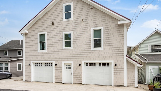 4721 W N Bank Rd, Buckeye Lake, OH 43008 - view of side of home featuring an attached garage and driveway