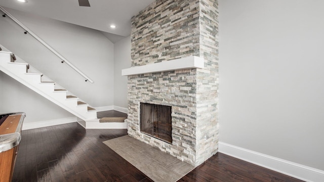 4721 W N Bank Rd, Buckeye Lake, OH 43008 - unfurnished living room featuring a stone fireplace, hardwood / wood-style floors, recessed lighting, stairs, and ceiling fan