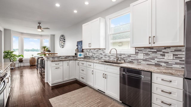 4721 W N Bank Rd, Buckeye Lake, OH 43008 - kitchen with dishwasher, recessed lighting, a peninsula, a ceiling fan, and white cabinetry