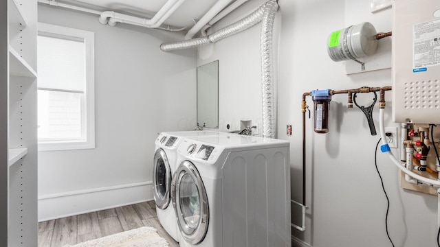 4721 W N Bank Rd, Buckeye Lake, OH 43008 - laundry room featuring washer and clothes dryer and light wood-style floors