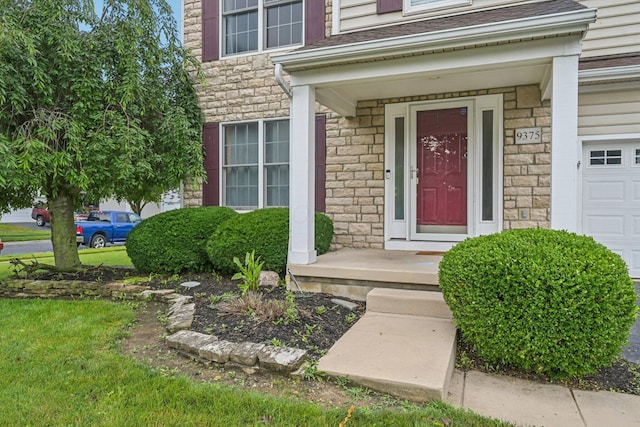 9375 Wingate Pl, Orient, OH 43146 - entrance to property with stone siding and an attached garage