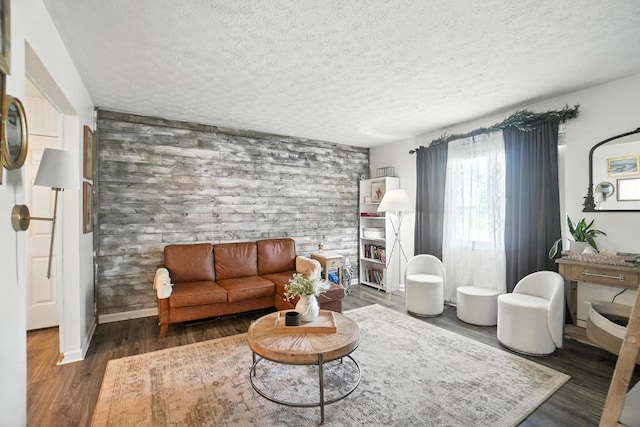 1978 Candlenut Cir, Grove City, OH 43123 - living area with wooden walls, a textured ceiling, wood finished floors, and an accent wall