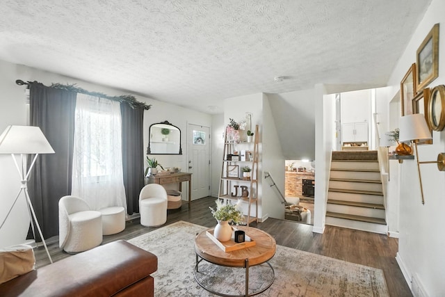 1978 Candlenut Cir, Grove City, OH 43123 - living area featuring dark wood-style floors, a textured ceiling, and stairs