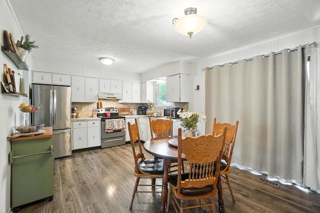 1978 Candlenut Cir, Grove City, OH 43123 - dining room with a textured ceiling and dark wood finished floors
