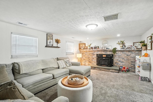 1978 Candlenut Cir, Grove City, OH 43123 - carpeted living area with a wood stove and a textured ceiling