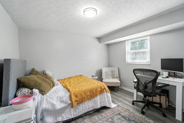 1978 Candlenut Cir, Grove City, OH 43123 - bedroom featuring a textured ceiling, wood finished floors, and an office area