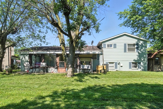 1978 Candlenut Cir, Grove City, OH 43123 - back of house featuring a lawn and a sunroom