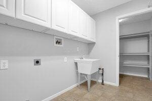 684 Old Dover Rd, Westerville, OH 43082 - laundry room with cabinet space, hookup for a washing machine, and electric dryer hookup