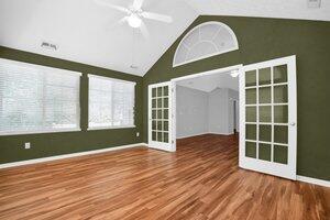 684 Old Dover Rd, Westerville, OH 43082 - unfurnished living room featuring vaulted ceiling, wood finished floors, and a ceiling fan