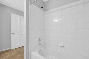 684 Old Dover Rd, Westerville, OH 43082 - bathroom featuring bathtub / shower combination and tile patterned floors