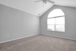 684 Old Dover Rd, Westerville, OH 43082 - unfurnished room with a ceiling fan, vaulted ceiling, and carpet floors