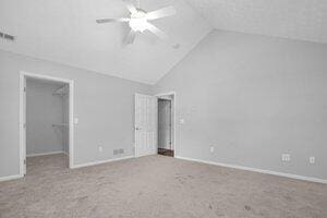 684 Old Dover Rd, Westerville, OH 43082 - unfurnished bedroom with a spacious closet, carpet, ceiling fan, a closet, and high vaulted ceiling