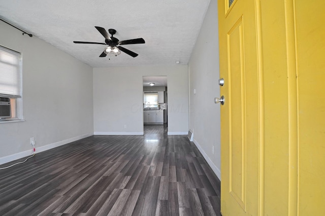 1458 E 22nd Ave, Columbus, OH 43211 - empty room with dark wood finished floors, a textured ceiling, and ceiling fan