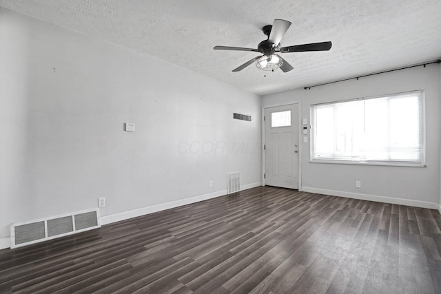 1458 E 22nd Ave, Columbus, OH 43211 - foyer with a textured ceiling, dark wood-style flooring, and ceiling fan