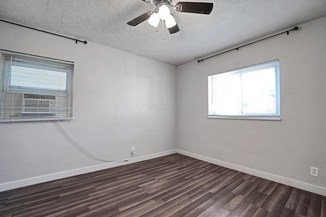 1458 E 22nd Ave, Columbus, OH 43211 - empty room featuring dark wood-style floors, a textured ceiling, and a ceiling fan