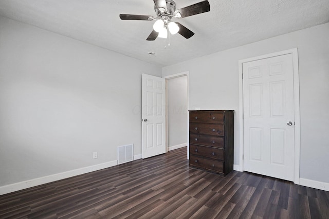 1458 E 22nd Ave, Columbus, OH 43211 - unfurnished bedroom featuring dark wood-style flooring and ceiling fan