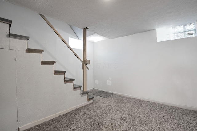1458 E 22nd Ave, Columbus, OH 43211 - basement with carpet, stairway, and a textured ceiling