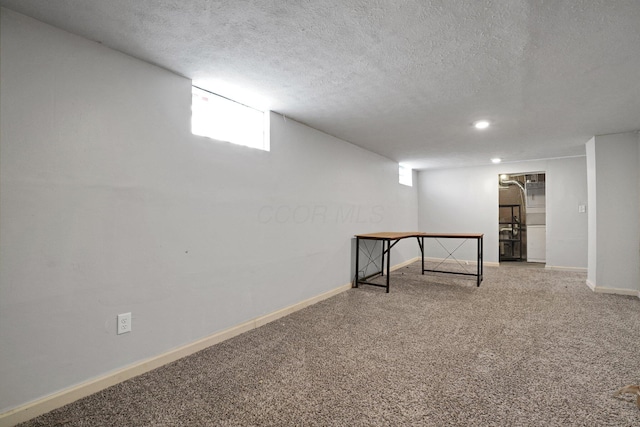 1458 E 22nd Ave, Columbus, OH 43211 - basement with carpet flooring, a textured ceiling, and recessed lighting
