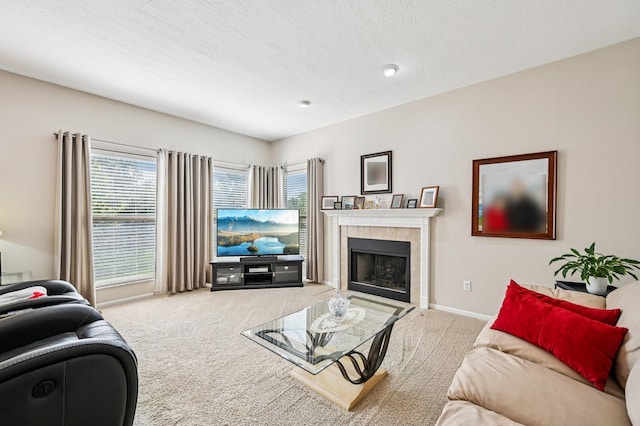 1077 Taylor Mills Dr, Reynoldsburg, OH 43068 - living area with carpet floors, plenty of natural light, a tile fireplace, and a textured ceiling