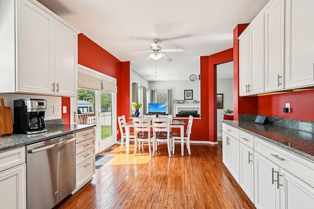 1077 Taylor Mills Dr, Reynoldsburg, OH 43068 - kitchen featuring dishwasher, ceiling fan, light wood-type flooring, and white cabinets