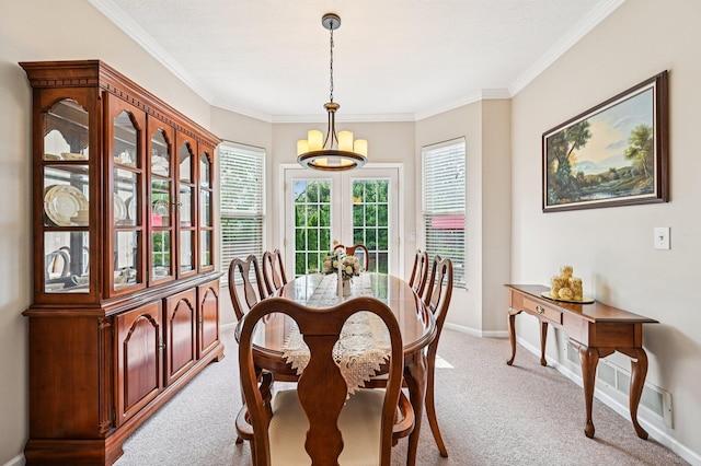 1077 Taylor Mills Dr, Reynoldsburg, OH 43068 - dining area featuring light colored carpet, a chandelier, and crown molding