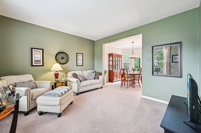 1077 Taylor Mills Dr, Reynoldsburg, OH 43068 - living room featuring carpet flooring and a chandelier