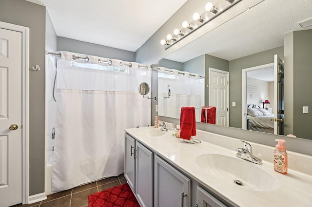 1077 Taylor Mills Dr, Reynoldsburg, OH 43068 - full bathroom featuring double vanity, tile patterned floors, ensuite bathroom, and shower / bathtub combination with curtain