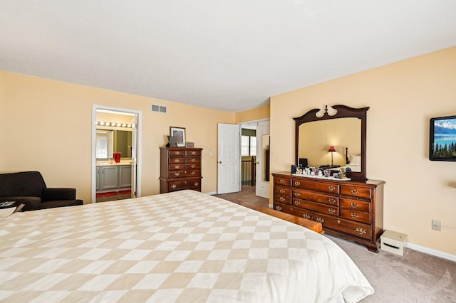 1077 Taylor Mills Dr, Reynoldsburg, OH 43068 - carpeted bedroom featuring baseboards and ensuite bathroom