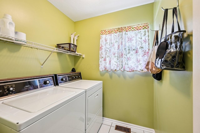 1077 Taylor Mills Dr, Reynoldsburg, OH 43068 - laundry room with separate washer and dryer and light tile patterned floors