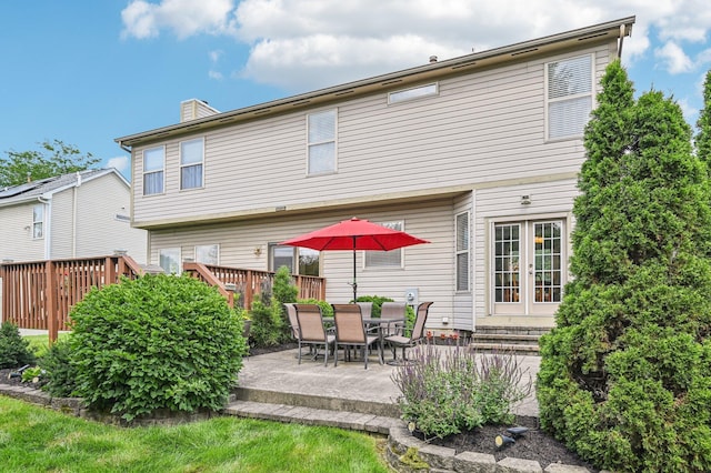 1077 Taylor Mills Dr, Reynoldsburg, OH 43068 - back of property featuring a chimney and a patio