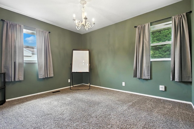 3139 Woonsocket St, Springfield, OH 45503 - carpeted spare room with a chandelier and baseboards