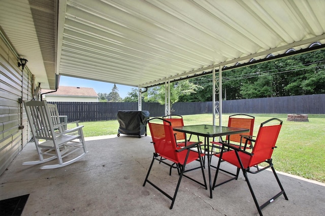 3139 Woonsocket St, Springfield, OH 45503 - fenced backyard with an outdoor fire pit, a patio area, a grill, and outdoor dining space