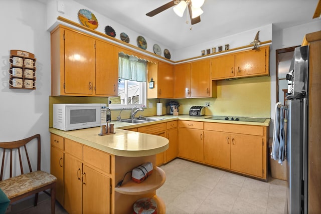 3329 Clime Rd, Columbus, OH 43223 - kitchen with white microwave, refrigerator, a peninsula, and light countertops