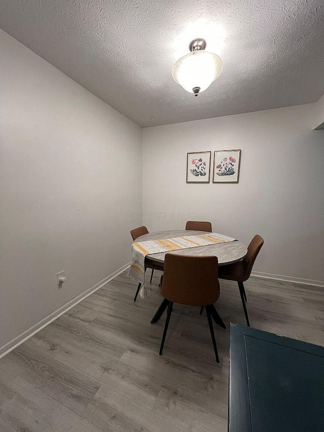 5258 Captains Ct, Columbus, OH 43220 - dining room with wood finished floors and a textured ceiling