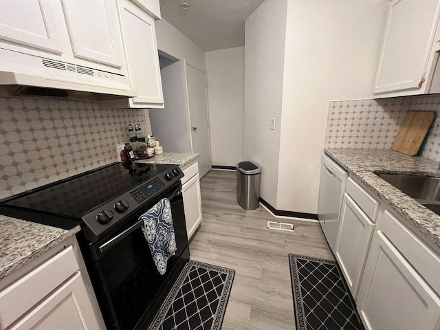 5258 Captains Ct, Columbus, OH 43220 - kitchen featuring black range with electric cooktop, white dishwasher, under cabinet range hood, and decorative backsplash