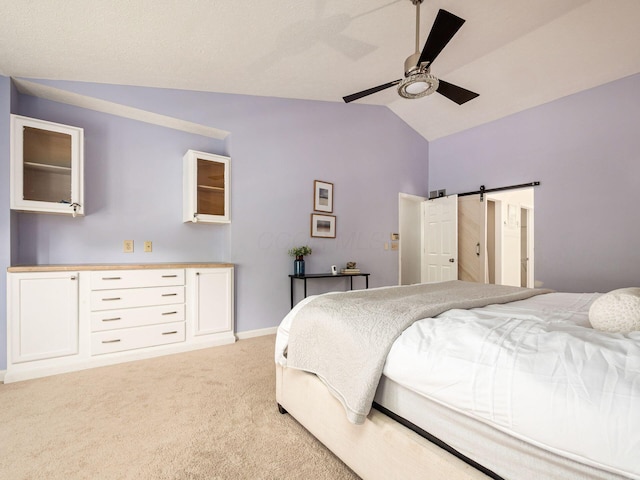 824 Lynnfield Dr, Westerville, OH 43081 - bedroom with lofted ceiling, light carpet, ceiling fan, and a barn door