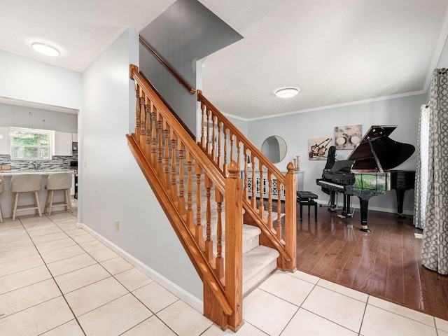 824 Lynnfield Dr, Westerville, OH 43081 - staircase with tile patterned flooring and ornamental molding