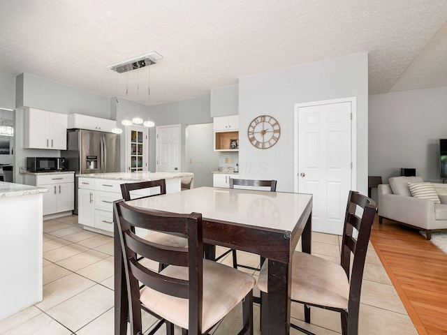 824 Lynnfield Dr, Westerville, OH 43081 - dining room featuring light tile patterned flooring and a textured ceiling