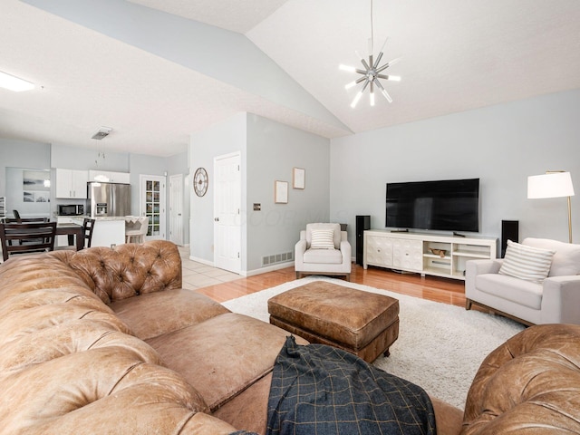 824 Lynnfield Dr, Westerville, OH 43081 - living area featuring a chandelier, light wood-type flooring, and lofted ceiling