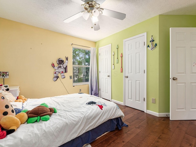 824 Lynnfield Dr, Westerville, OH 43081 - bedroom featuring wood-type flooring, multiple closets, a ceiling fan, and a textured ceiling