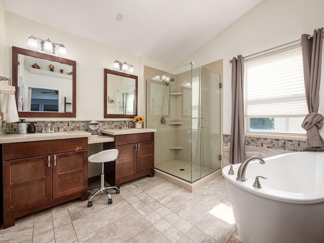 824 Lynnfield Dr, Westerville, OH 43081 - bathroom with a stall shower, a soaking tub, vanity, vaulted ceiling, and tasteful backsplash