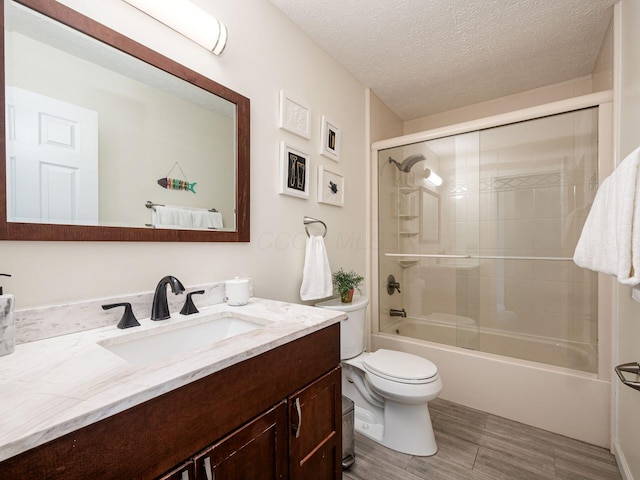 824 Lynnfield Dr, Westerville, OH 43081 - bathroom featuring vanity, shower / tub combination, a textured ceiling, and wood finished floors